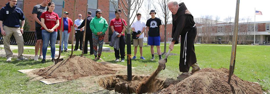 Students gathered for a tree planting ceremony on campus